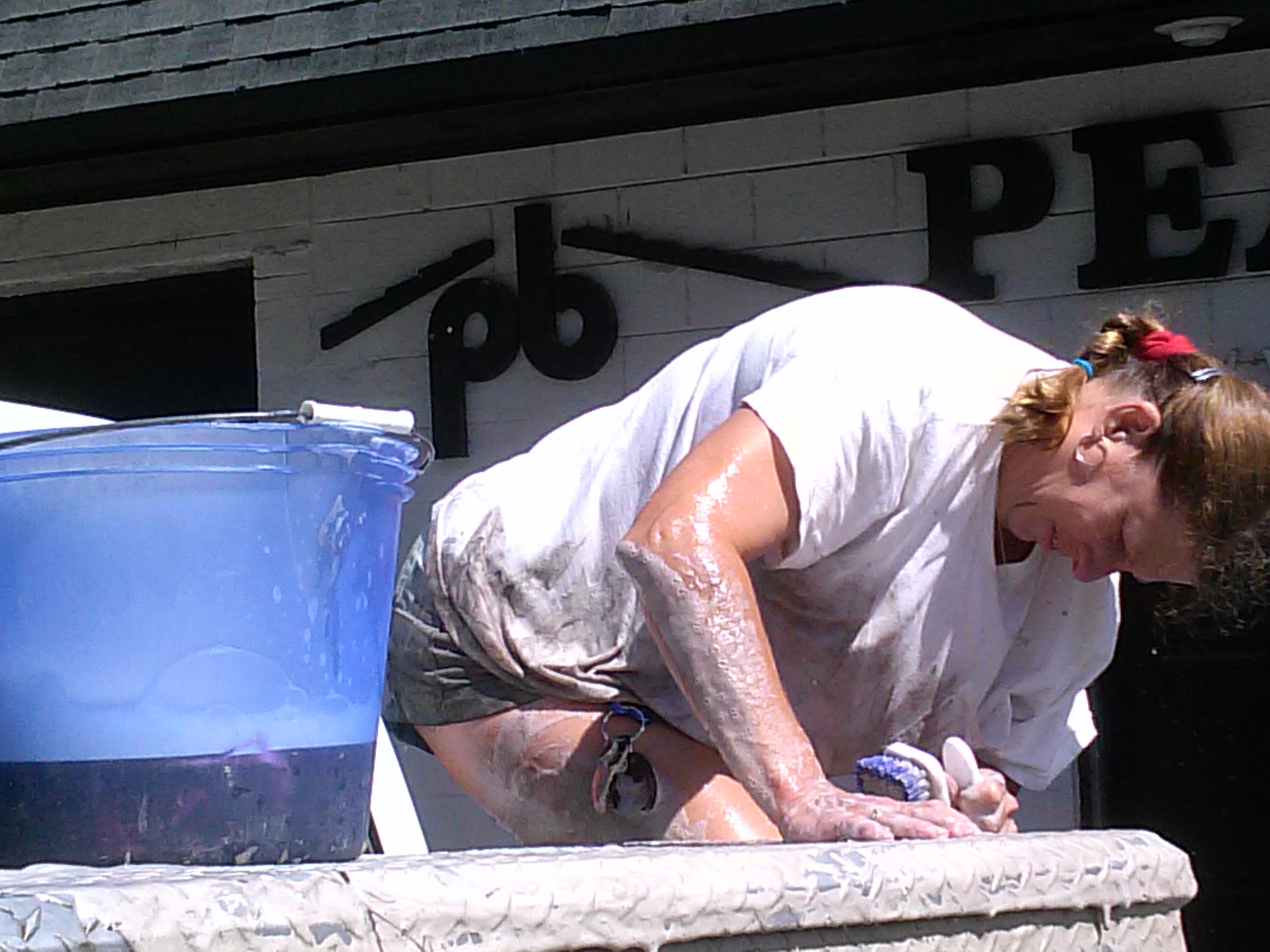 Joy cleaning a dirty truck