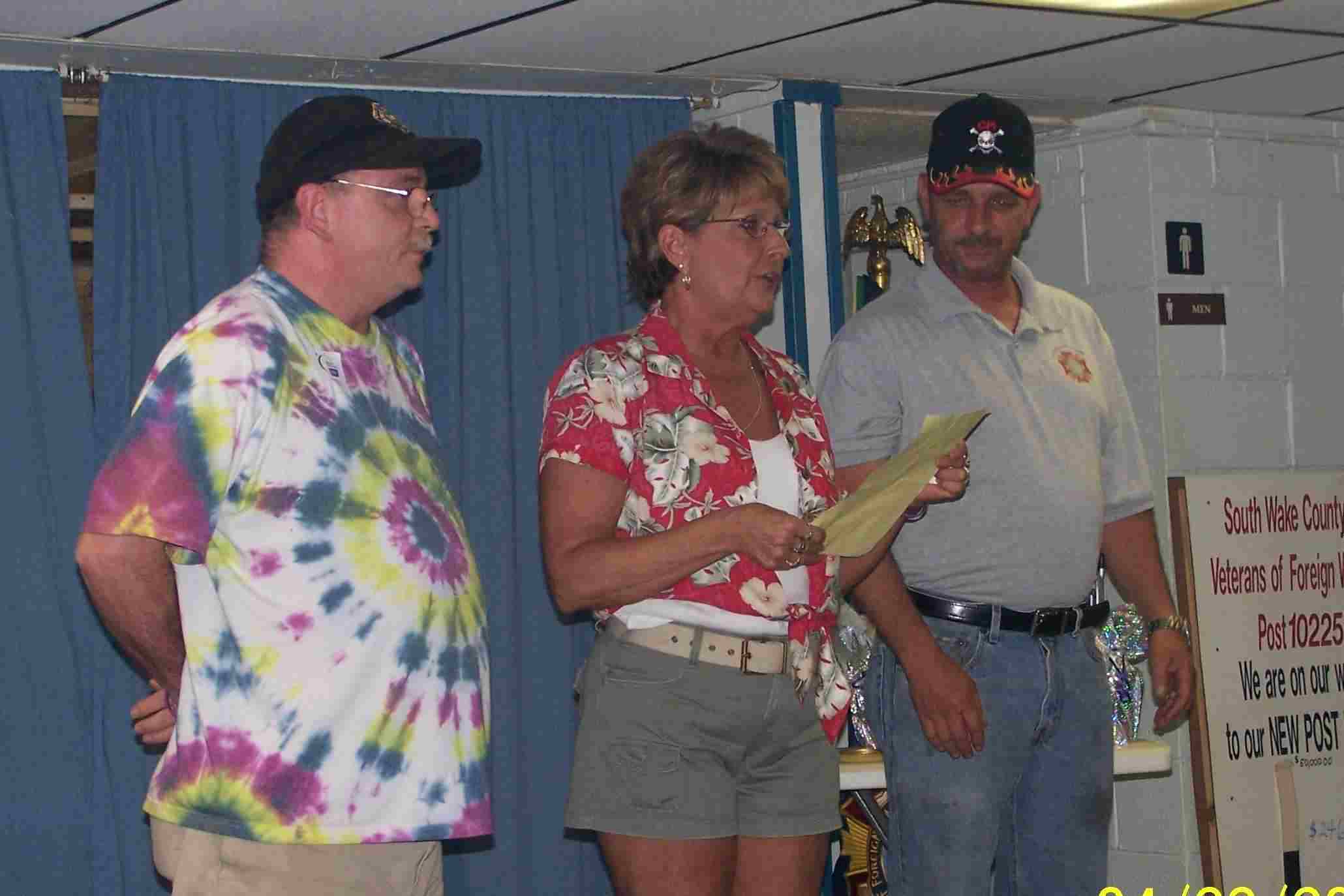 Teena presents the team members with the hightest and lowest penny count