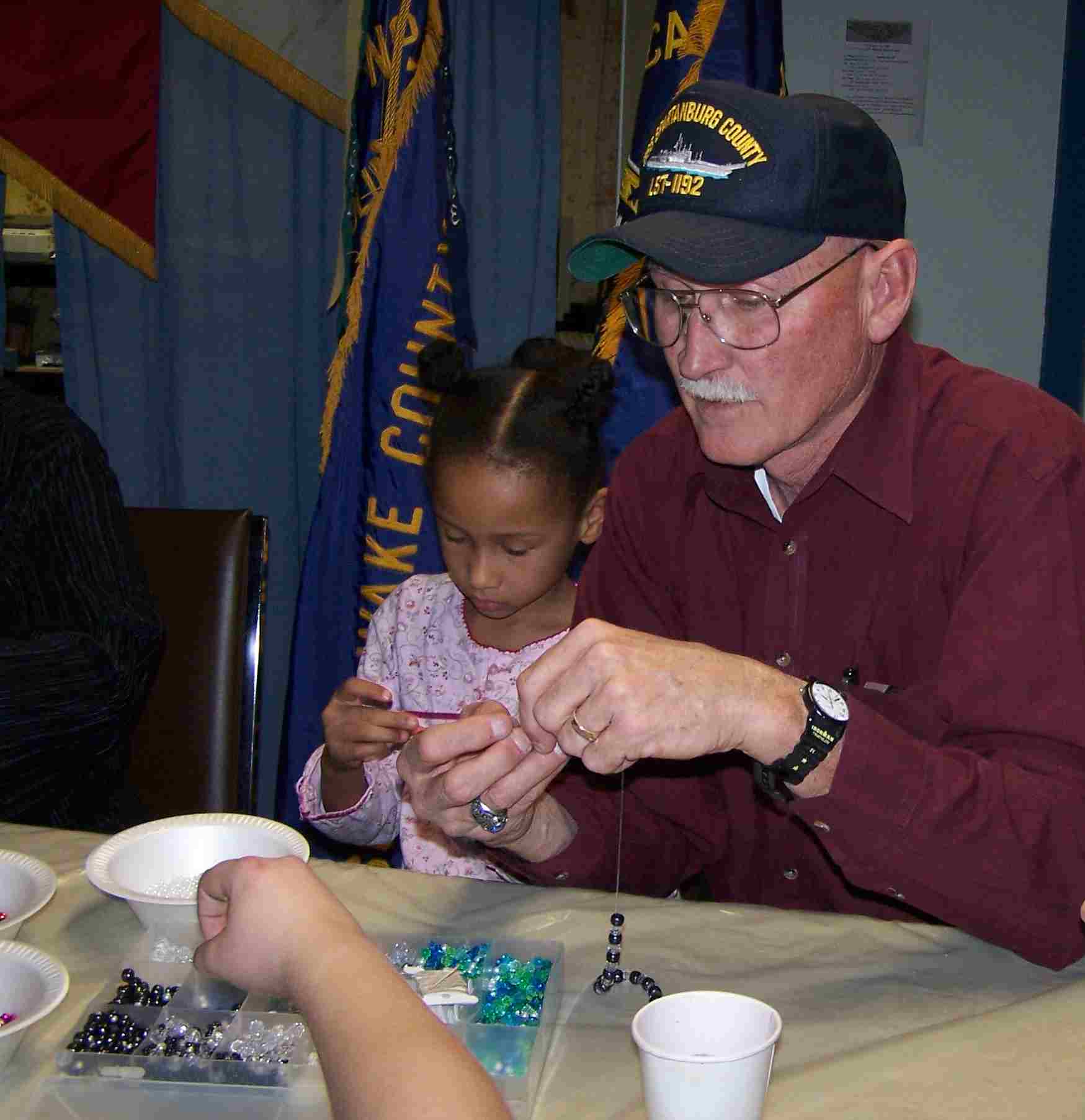 Picture of Alan helping with crafts